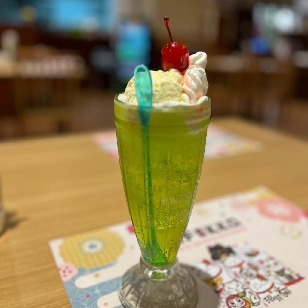 15+Best Japanese Drinks in 2026: From Matcha & Ramune to Sake, and Hidden Local Favorites 13 Melon Soda (メロンソーダ) – Bright green soft japanese drink