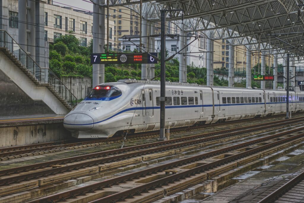Beginner's Ultimate Guide To The Shinkansen Train In Japan (2026) 9 Shinkansen train waiting at a railway station in Japan