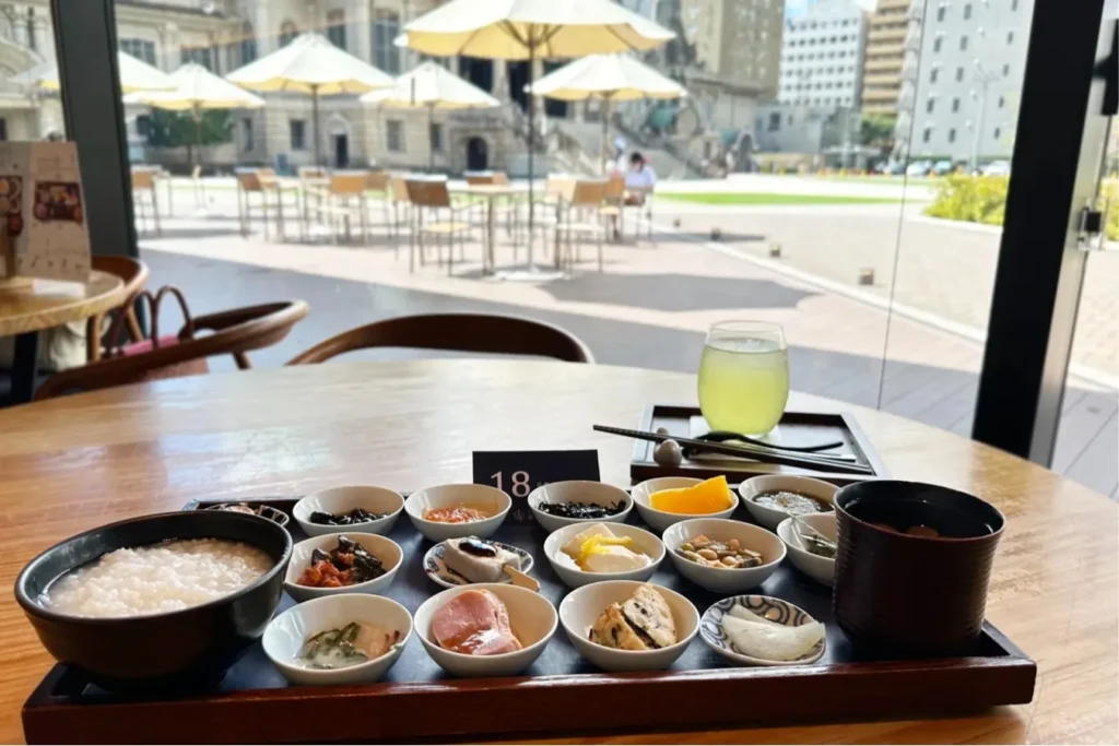 10 Cool Things To Do Solo in Tokyo (2026): Fun, Safe & Easy Ideas for Independent Travelers 9 18-item breakfast” at Tsukiji Honganji Cafe Tsumugi