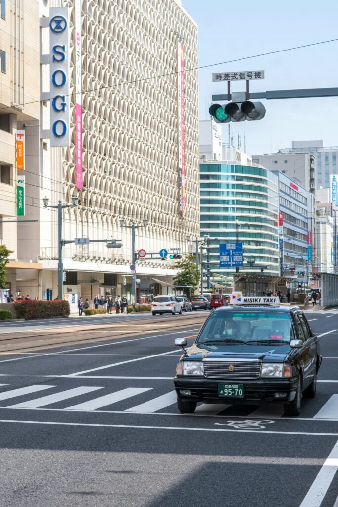 Is Japan Rail Pass Worth It in 2026: Pro Tips, Costs & Alternatives 13 Taxi riding in Tokyo
