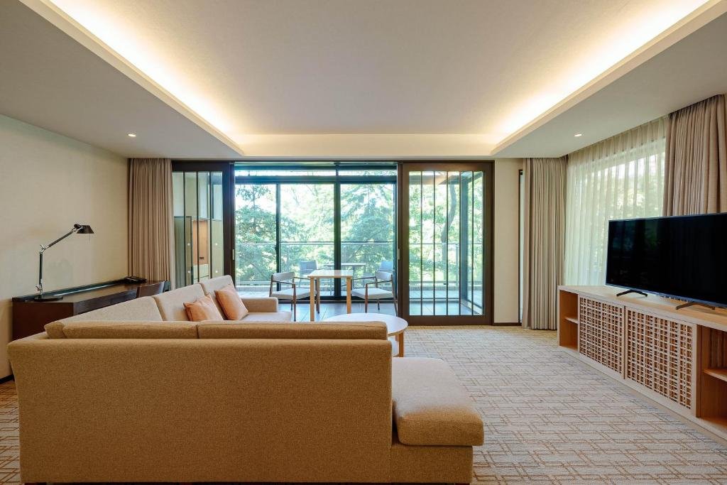 Best Luxury Hotels in Japan (2026): Top 9 Stunning Stays for an Unforgettable Trip 8 Hyatt Regency Hakone Resort and Spa lounge with warm fireplace and relaxed Hakone setting