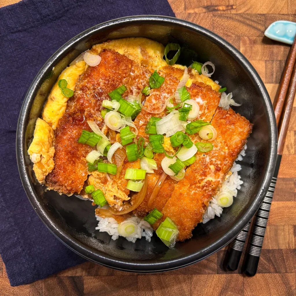 Perfect 9 Days in Tokyo Itinerary (2026): Ultimate Plan for Sightseeing, Shopping, and Street Food 11 A katsudon—a rice bowl with a breaded cutlet (usually pork), egg, and onions simmered in a sweet-savory sauce