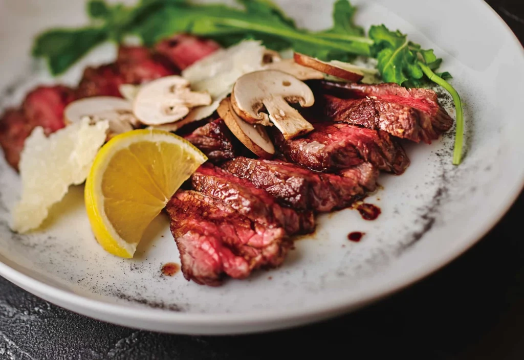 Where To Eat At Tokyo Station (2026): 20 Best Lunch Spots 7 Sliced steak with mushrooms and lemon