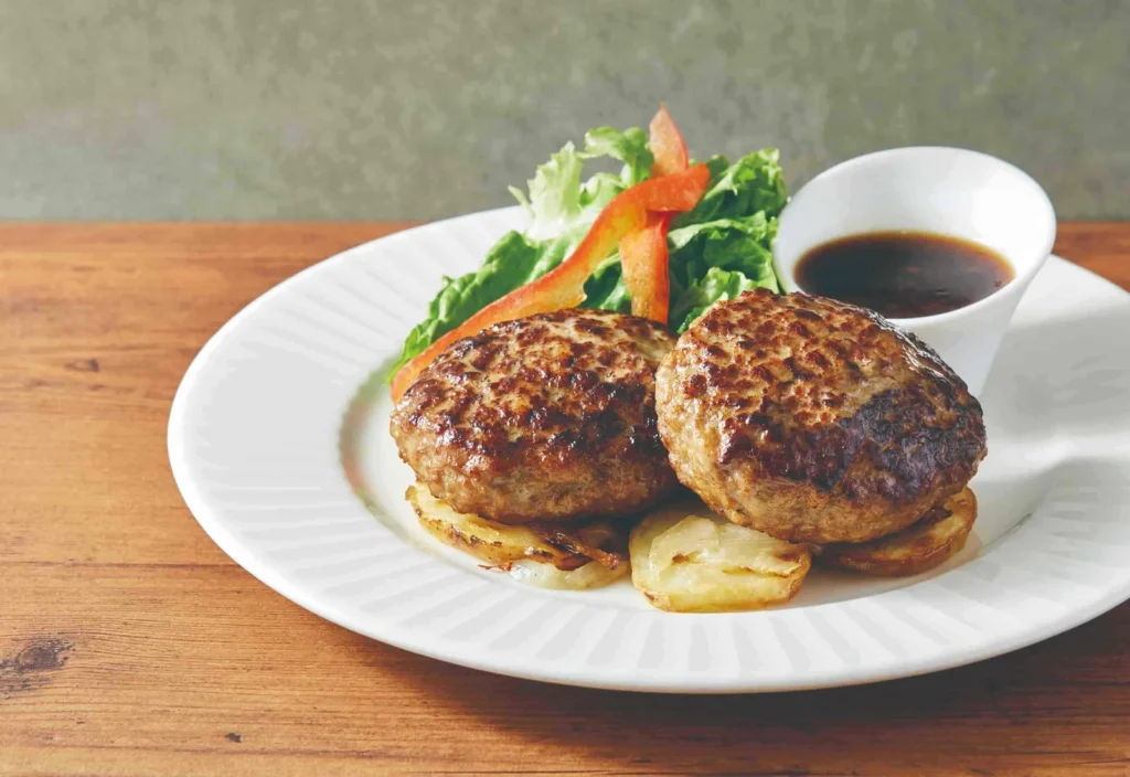 Where To Eat At Tokyo Station (2026): 20 Best Lunch Spots 9 Two patties with salad and sauce