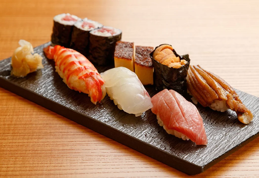 Where To Eat At Tokyo Station (2026): 20 Best Lunch Spots 20 Assorted sushi on a black plate