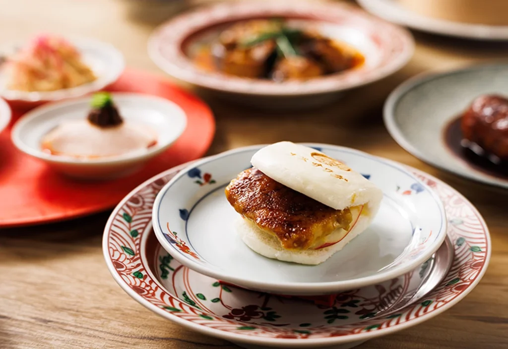 Where To Eat At Tokyo Station (2026): 20 Best Lunch Spots 21 Plated Asian cuisine with dumplings.