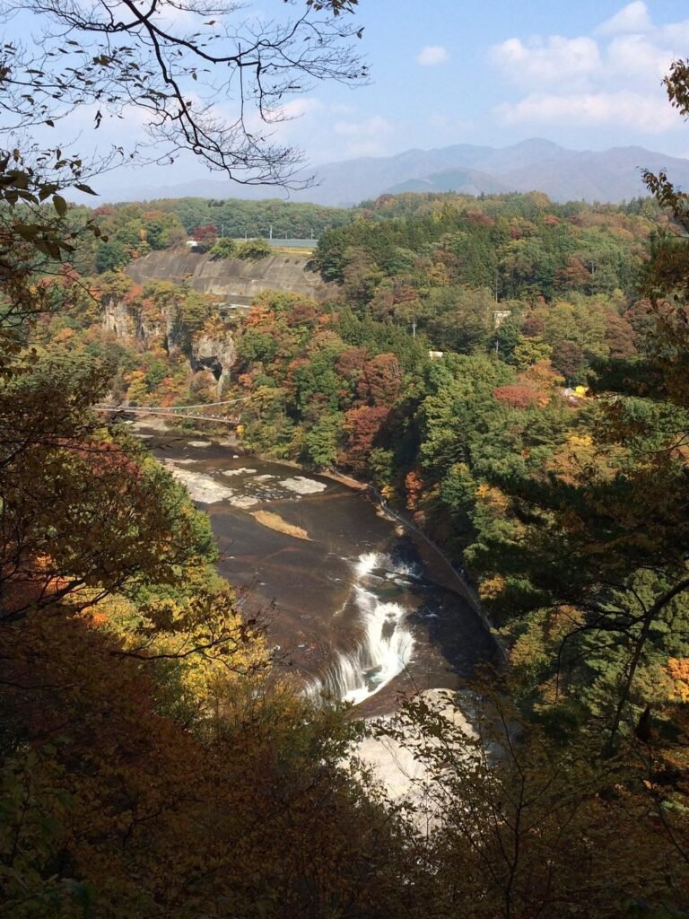 Fukiware Falls rushing through a rocky V-shaped gorge in Numata Gunma