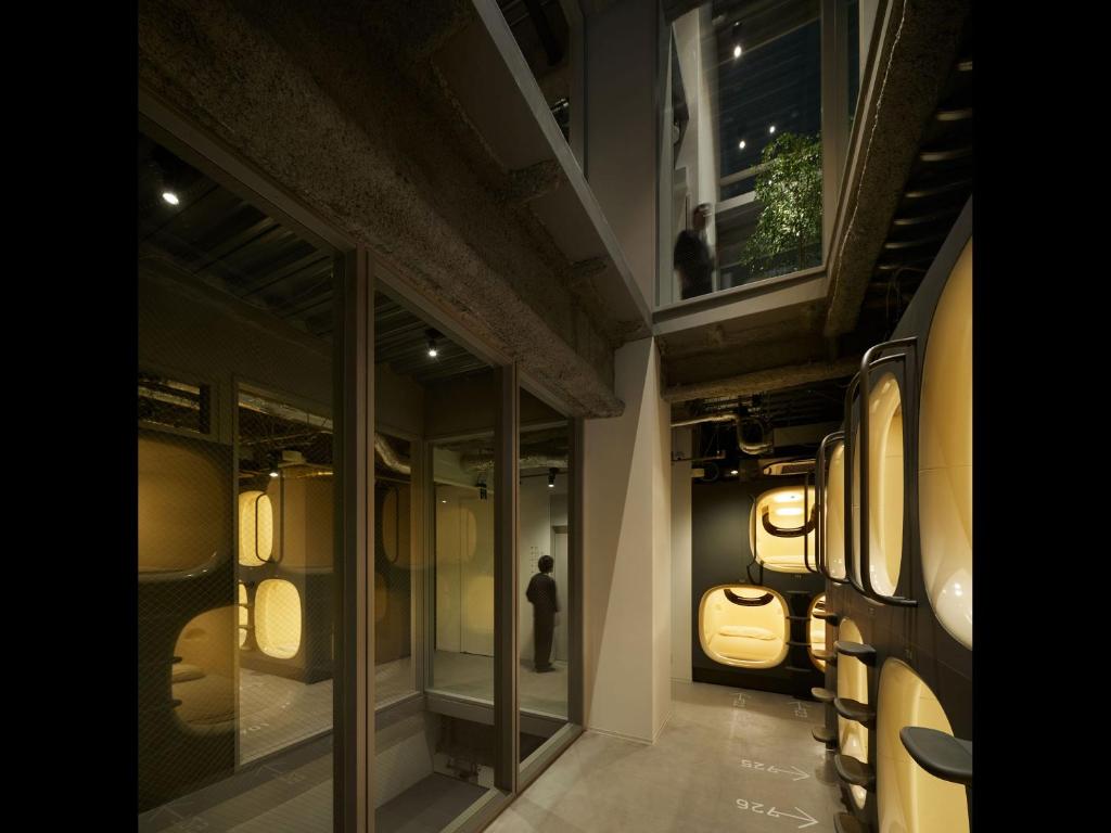 Unique Hotels in Tokyo (2026): 11 Cool, Wonderful, and Unforgettable Places to Stay 26 9h nine hours minimalist capsule sleeping pod and shared hotel area