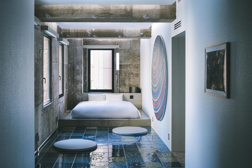 Unique Hotels in Tokyo (2026): 11 Cool, Wonderful, and Unforgettable Places to Stay 14 BnA_WALL colorful artist-designed hotel room in Nihonbashi Tokyo