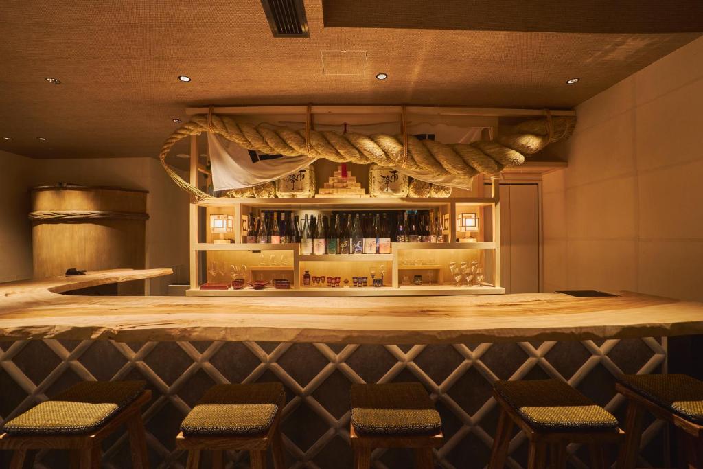 Unique Hotels in Tokyo (2026): 11 Cool, Wonderful, and Unforgettable Places to Stay 11 SAKE Bar Hotel Asakusa guest room with Japanese design in Tokyo