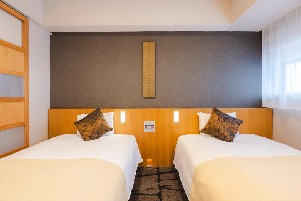 Unique Hotels in Tokyo (2026): 11 Cool, Wonderful, and Unforgettable Places to Stay 8 Hotel Gracery Shinjuku Godzilla-themed room with kaiju decor