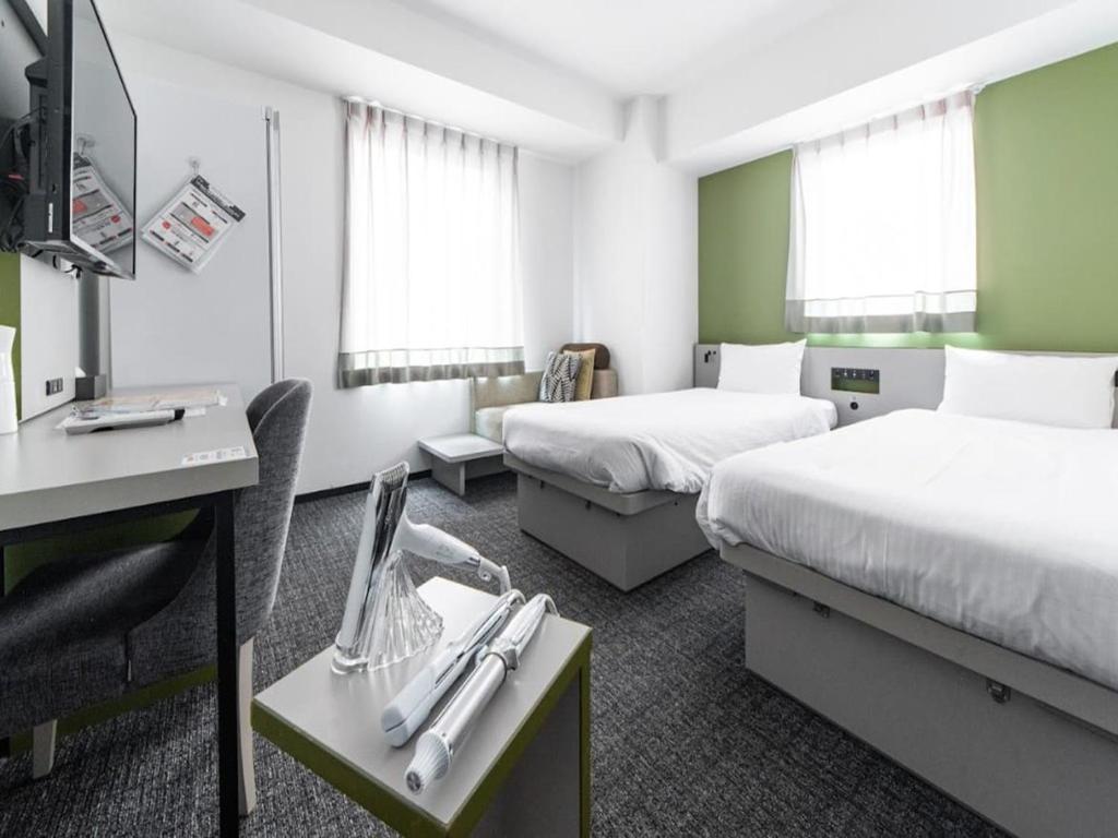 Unique Hotels in Tokyo (2026): 11 Cool, Wonderful, and Unforgettable Places to Stay 24 Henn na Hotel Ginza modern guest room with robot hotel concept
