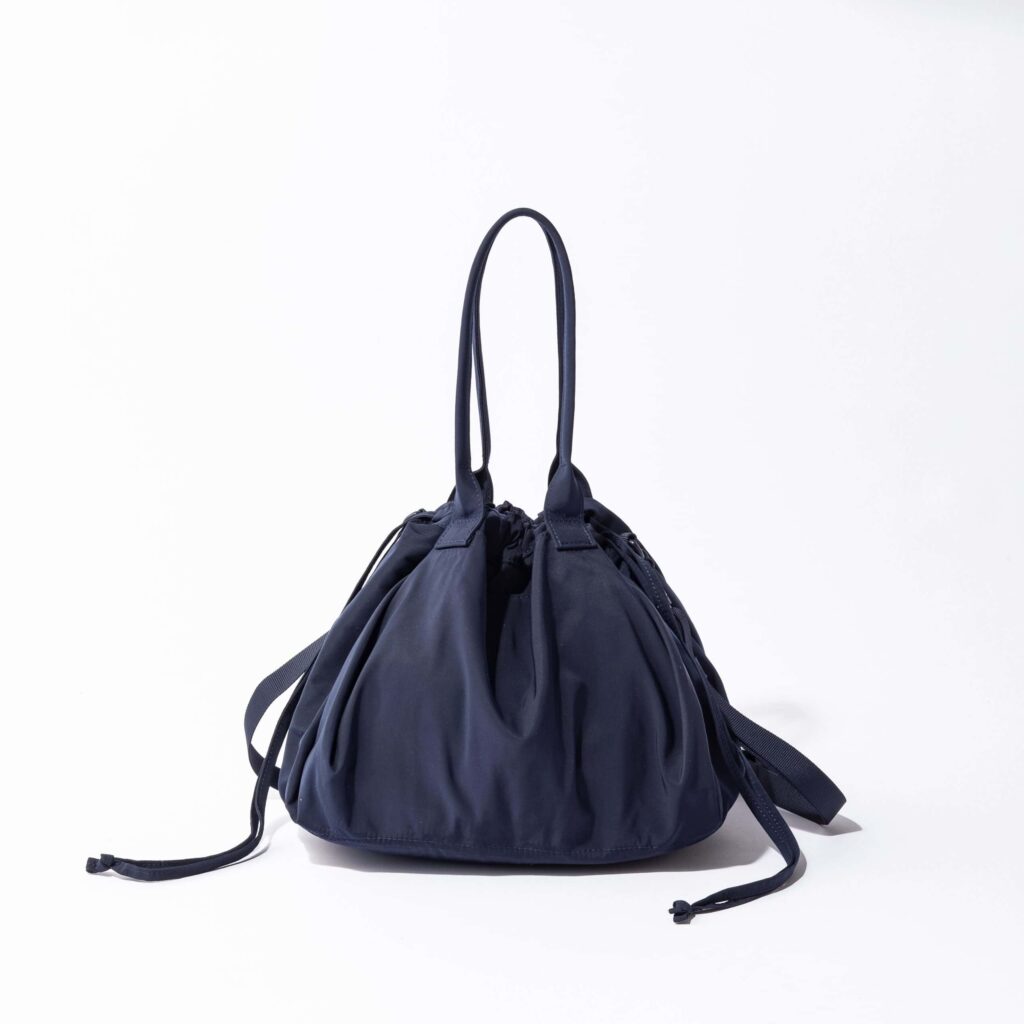 What to Buy in Uniqlo Japan (2026): 12 Best Fashion, Basics, and Travel Finds 18 UNIQLO drawstring bag with two-way crossbody and handheld design