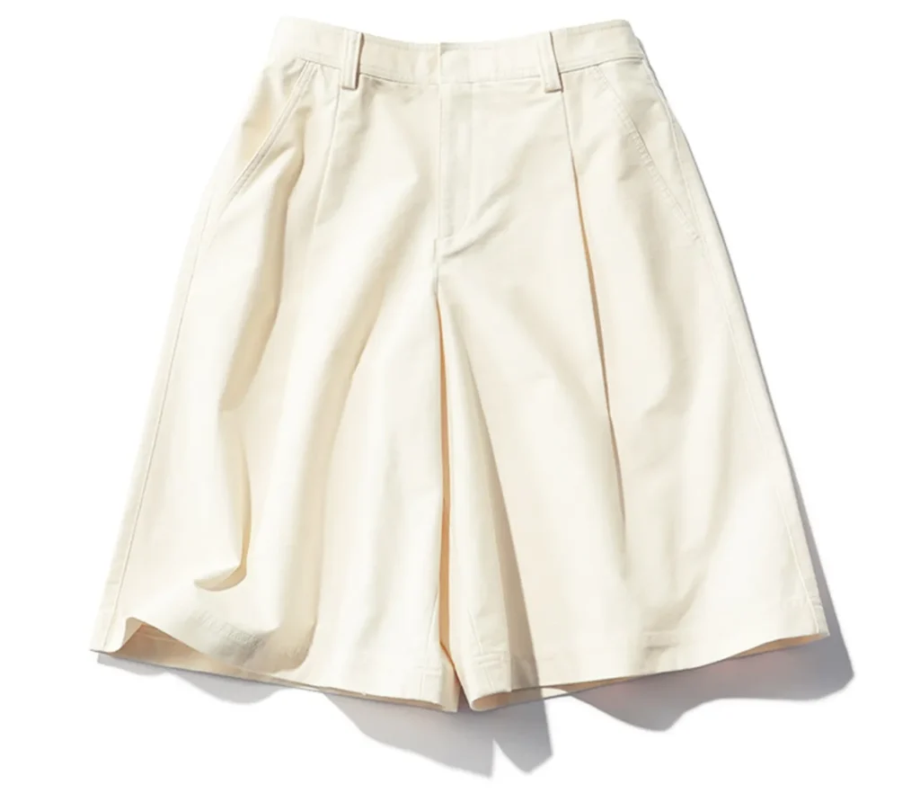 What to Buy in Uniqlo Japan (2026): 12 Best Fashion, Basics, and Travel Finds 8 UNIQLO white pleated half pants styled with a dressy top