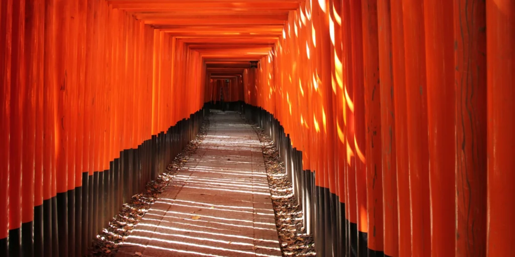 What to Do in Gion Kyoto in 2026: Beautiful Streets, Shrines and Local Experiences 9 Rows of vermilion torii gates at Fushimi Inari Taisha Shrine in Kyoto