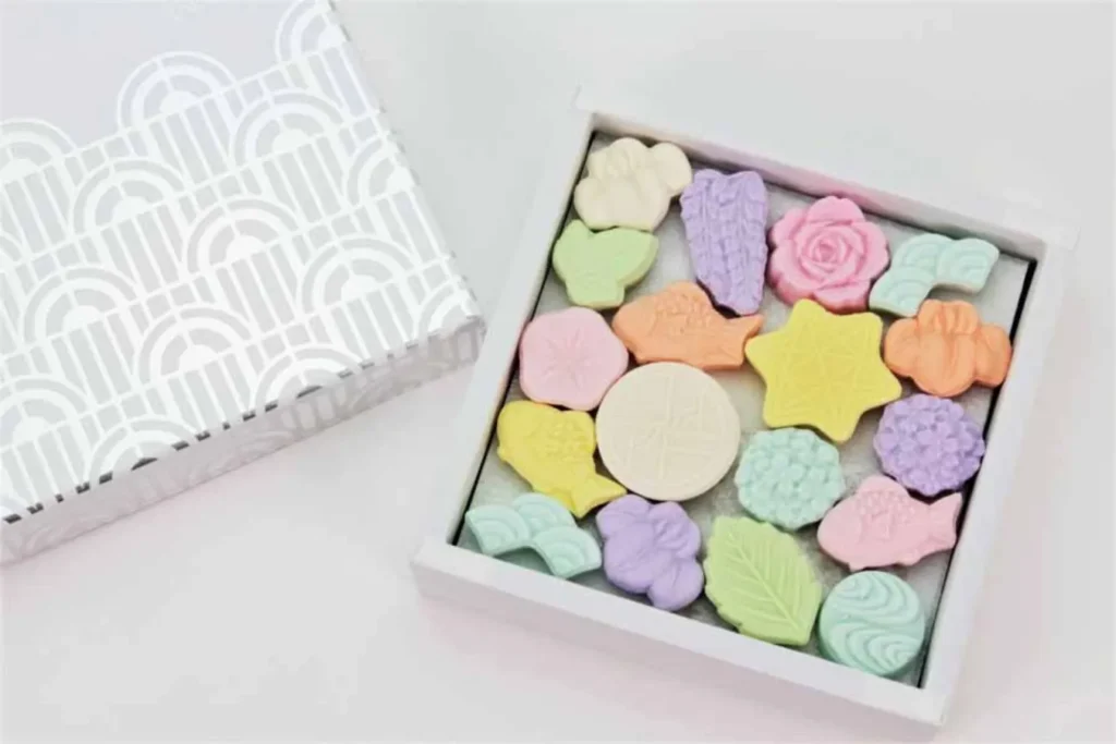 23 Most Unique Stores in Tokyo (2026): Sweets, Character Goods and Tokyo-Only Gifts 30 Original wasanbon sugar and Art Deco magnet badges from Lumière museum shop