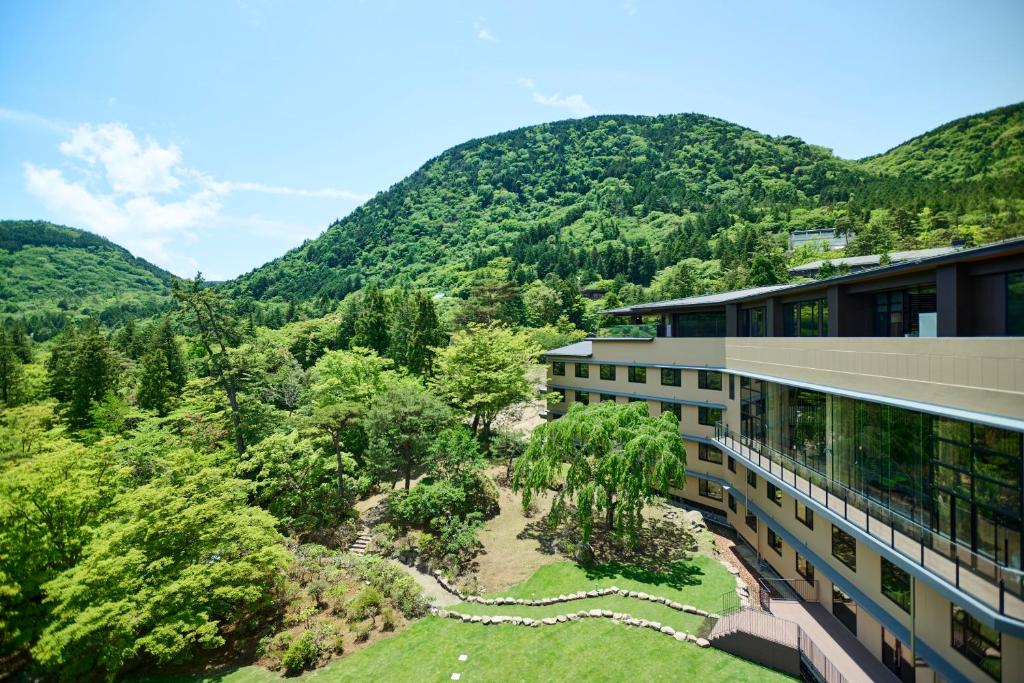 Hakone Hotel Kowakien beside a landscaped garden and green mountain scenery