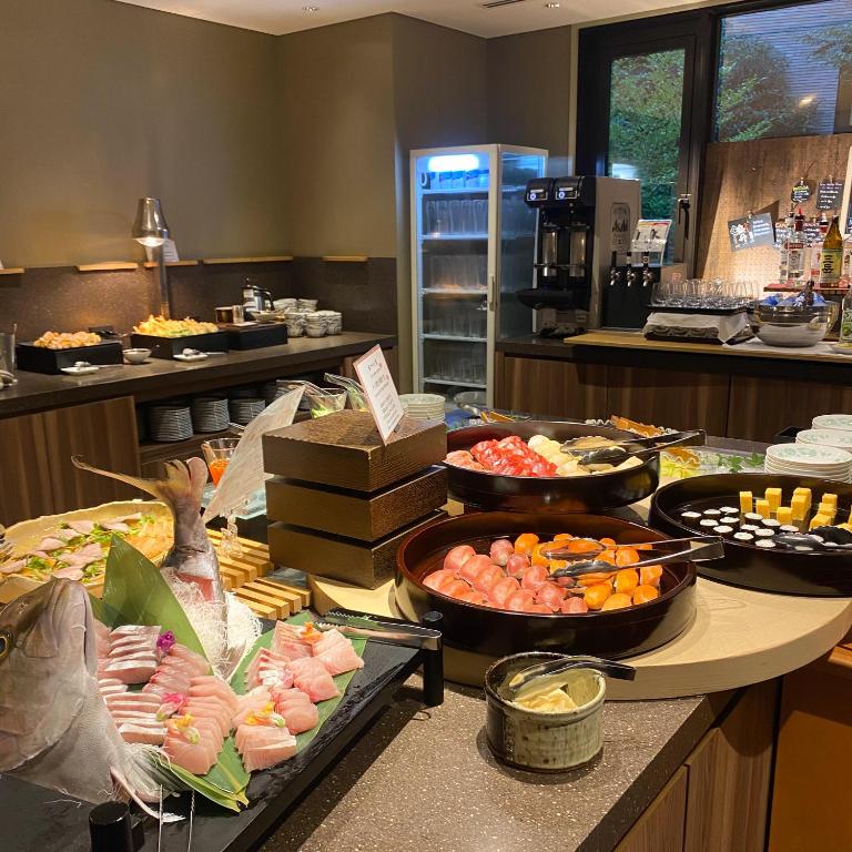 Dinner buffet at Hakone Yutowa with sushi, sashimi, hot dishes, drinks, and desserts