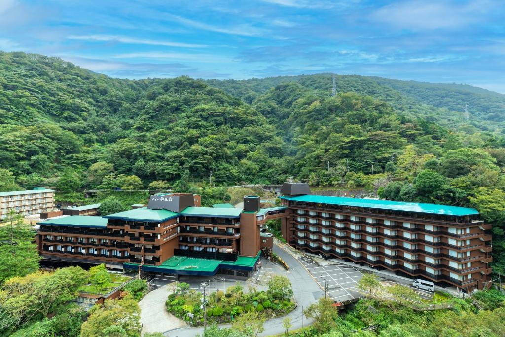 Hotel Nanpuso buildings surrounded by forested mountains in Hakone