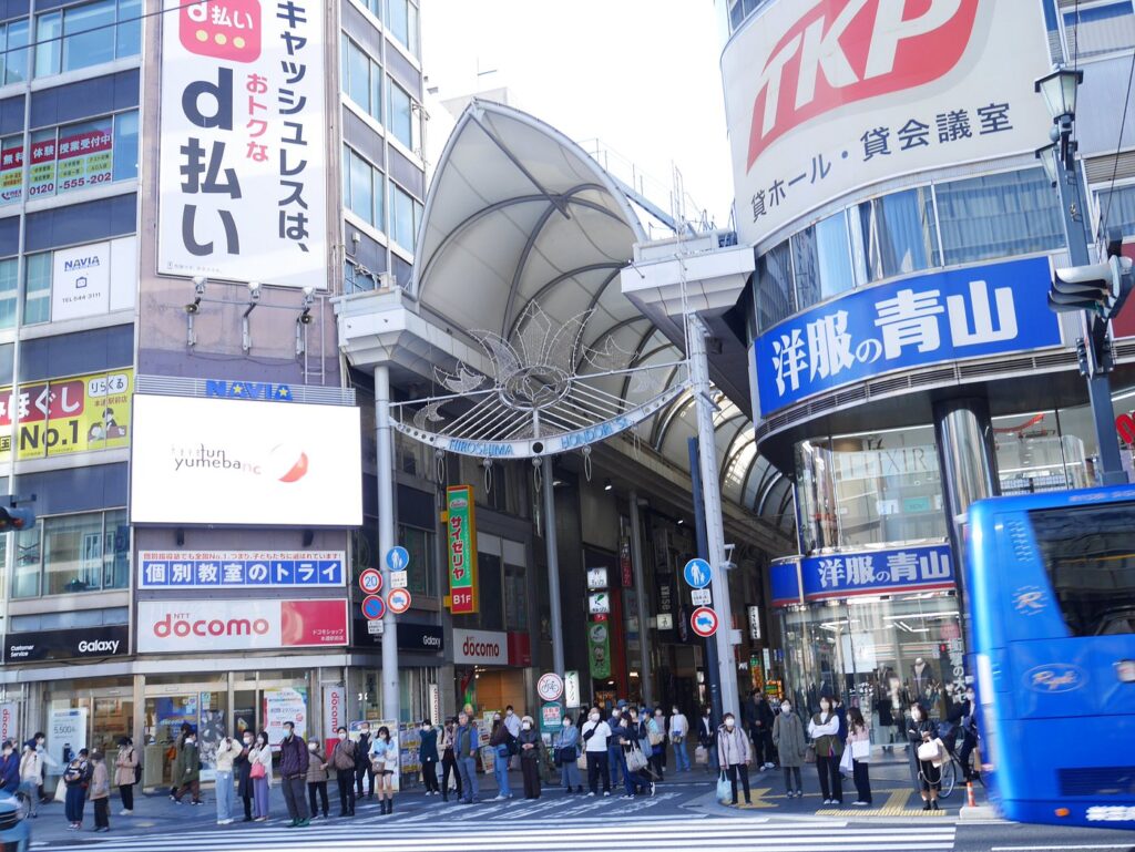 Best Shopping in Kobe Japan (2026): 25 Spots- Malls, Markets & Hidden Shops 22 Entrance to a covered neighbourhood shopping arcade with shops and pedestrians