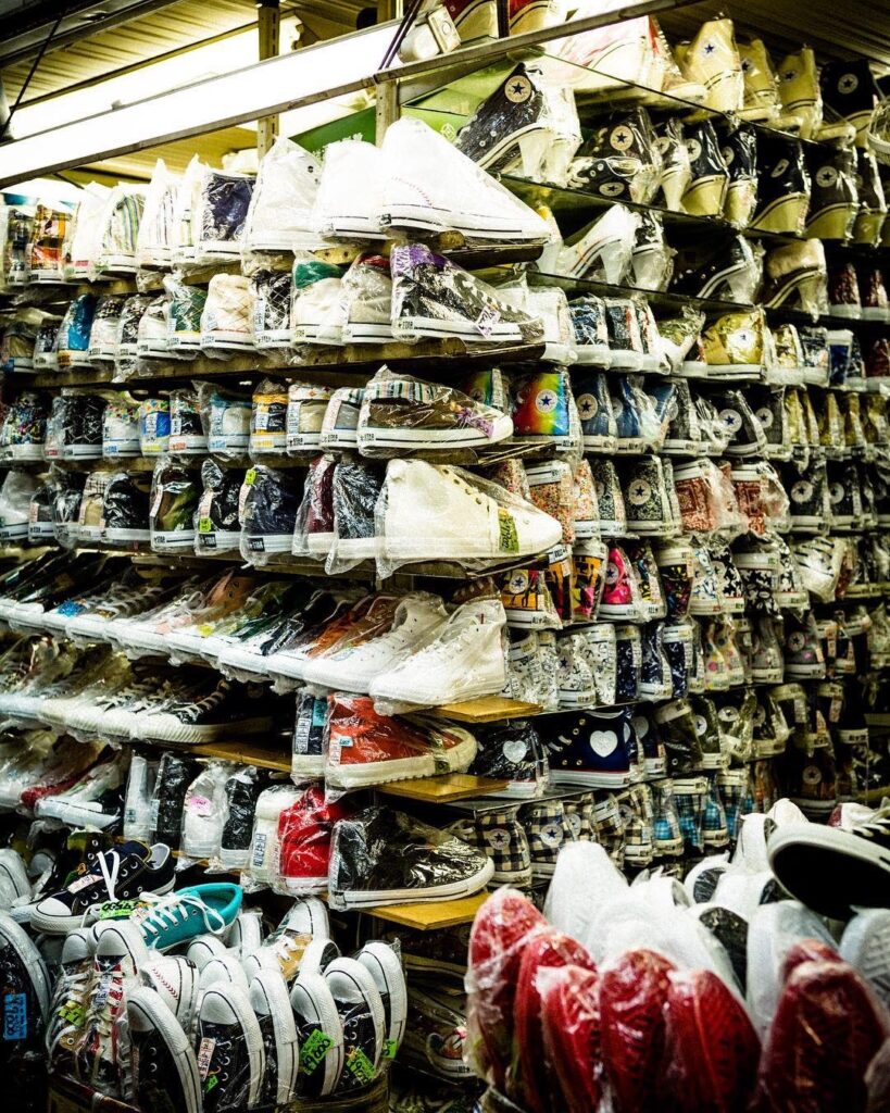 Best Shopping in Kobe Japan (2026): 25 Spots- Malls, Markets & Hidden Shops 24 Shelves packed with Converse sneakers at Kakimoto Shoten in Kobe