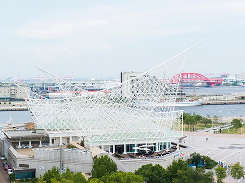 35 Best Things to Do in Kobe (2026): Waterfront Views, Mountain Escapes and Cultural Sights 8 White sail-shaped roof of Kobe Maritime Museum in Meriken Park