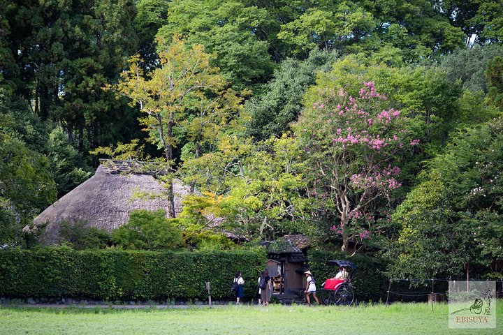 Traditional rickshaw carrying visitors through Arashiyama in Kyoto
