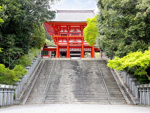 20 Best Things to Do in Shiga (2026): Lake Biwa, Castles, Shrines and More 7 Vermilion entrance gate and stone steps at Omi Jingu Shrine in Otsu, Shiga